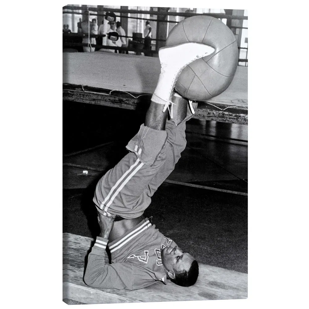 366111_canvas تابلو بوم کنواس طرح Joe Frazier during training with a medicine ball کد 402218 جو فریزر در حال تمرین با توپ پزشکی